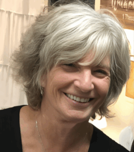 Smiling woman with short grey hair